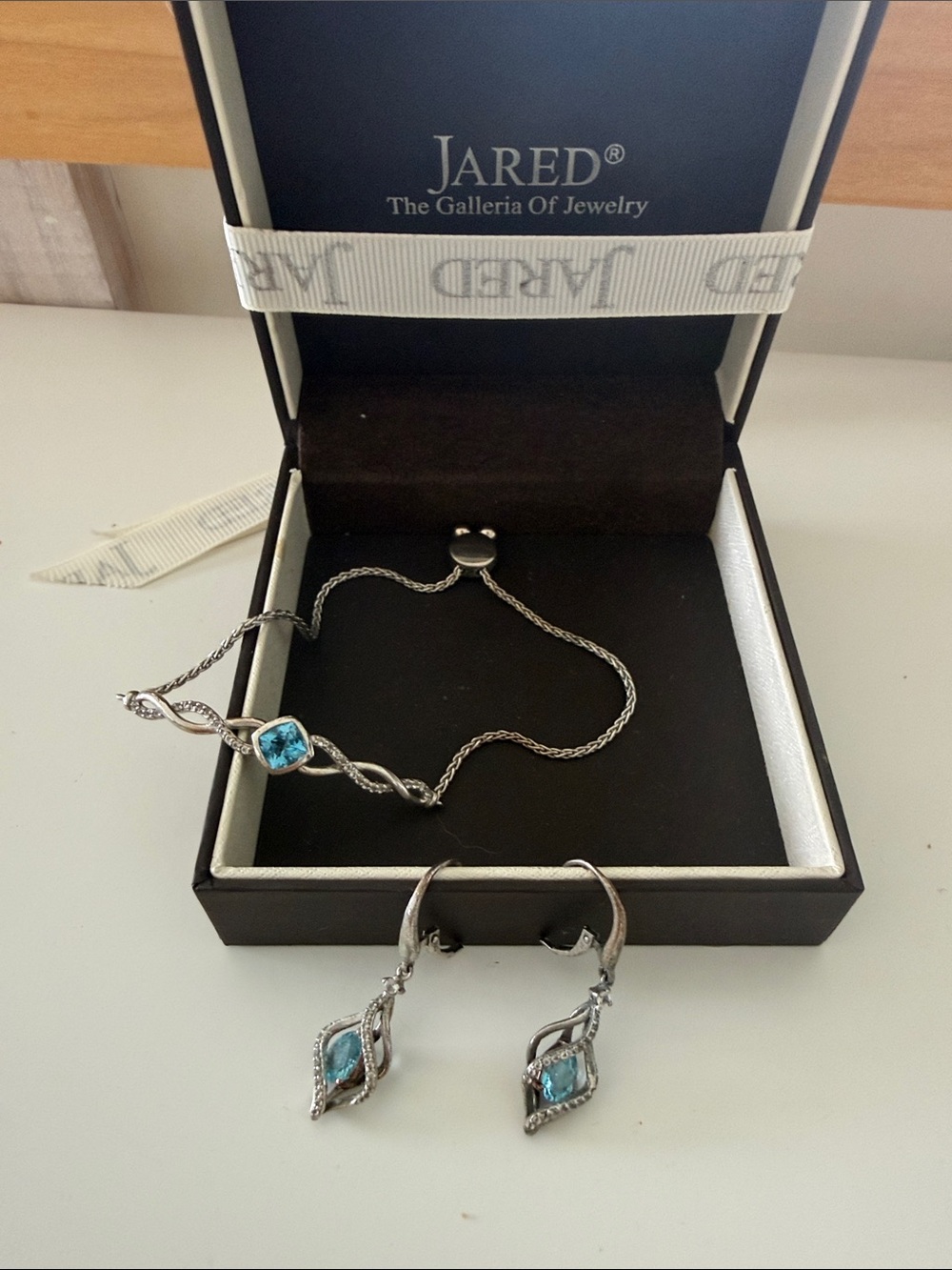 Jared Sterling Silver Blue Gem Drop Earrings and tennis bracelet